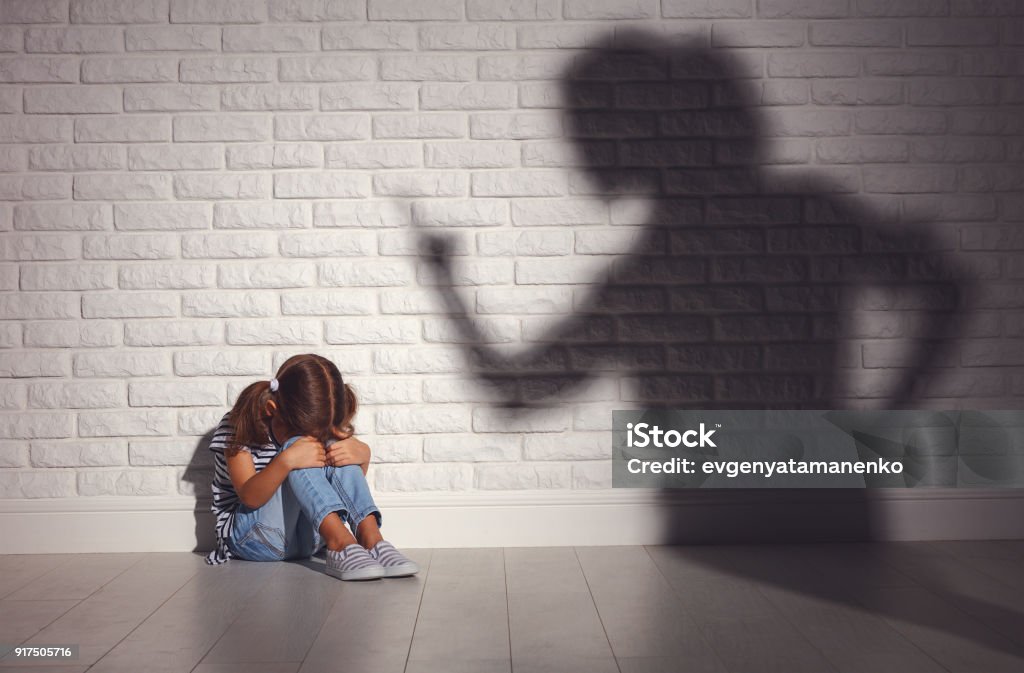 domestic violence. angry mother scolds   frightened daughter domestic violence. angry mother scolds   frightened daughter sitting on floor Child Stock Photo