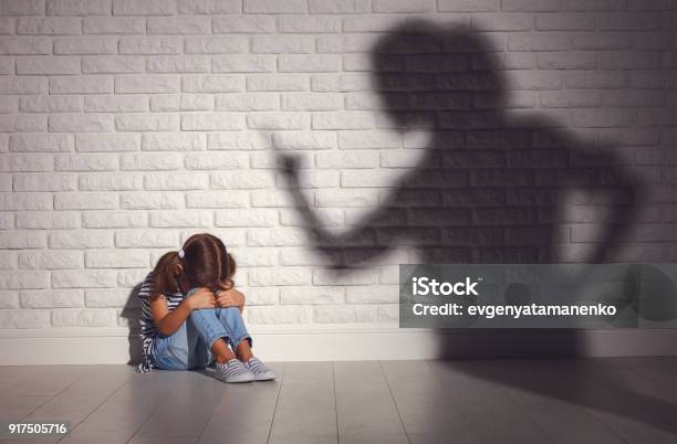 Domestic Violence Angry Mother Scolds Frightened Daughter Stock Photo - Download Image Now