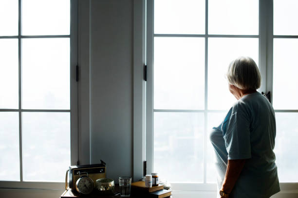 istock Senior woman standing alone at home 917508024