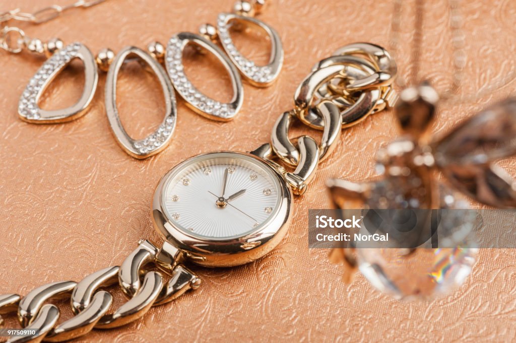 gold women wristwatch woman accessories, closeup shiny gold women wristwatch Adult Stock Photo