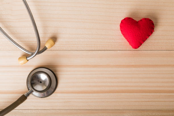 istock Valentines day background. Red heart on wooden table with copy space 917513008