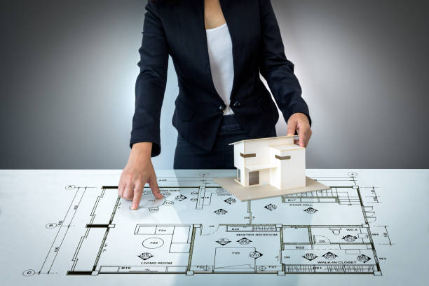 istock Businesswoman (Architect / Interior designer) working on modern futuristic virtual table 917515774