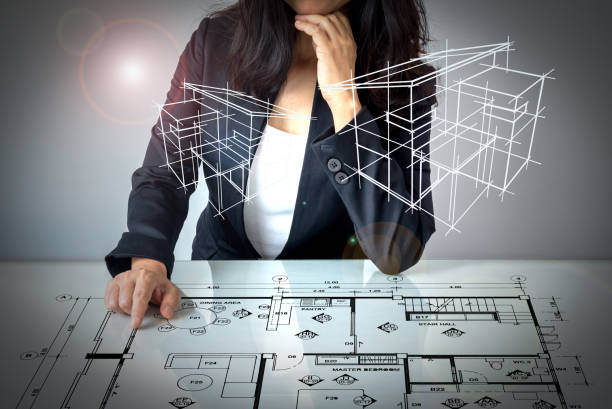 Businesswoman (Architect / Interior designer) working on modern futuristic virtual table stock photo