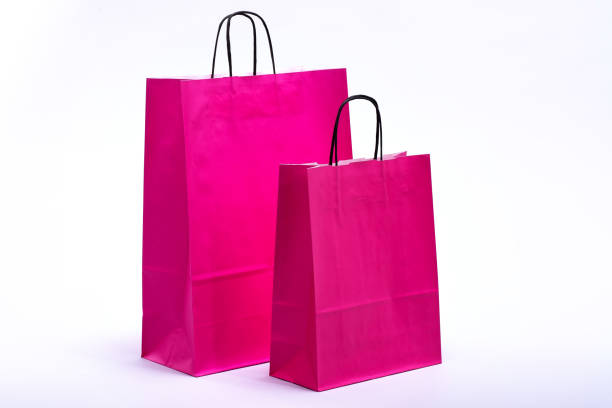 istock pink paper bags for shopping 917518118