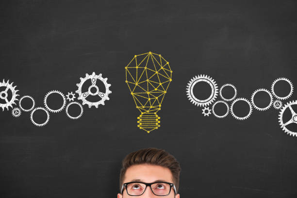 istock Innovation concept with light bulbs on a chalkboard background 917521988