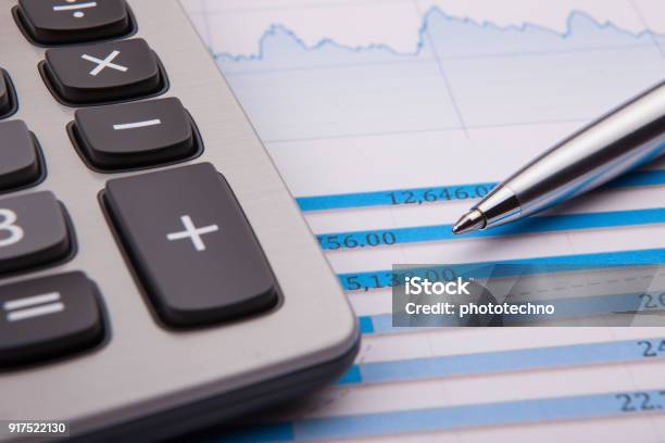 Calculator Pen And Business Balance Stock Photo - Download Image Now - Finance, Analyzing, Business