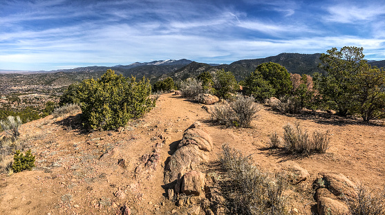 View of Santa Fe and the Sangre de Cristo Mountains from Atalaya Mountain. Northern New Mexico. American Southwest.