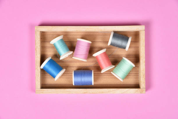 Thread rolls, Group of colorful thread on sewing desk, Craft, sewing and needlework concept. Thread rolls, Group of colorful thread on sewing desk, Craft, sewing and needlework concept. sewing thread rolled up creation stock pictures, royalty-free photos & images