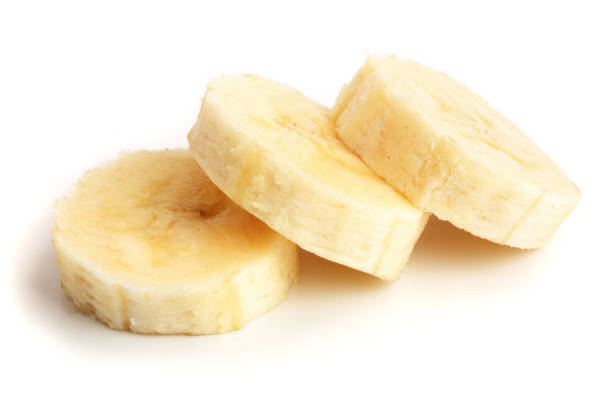 istock Banana slices isolated on a white background. Flat lay, top view 917525438