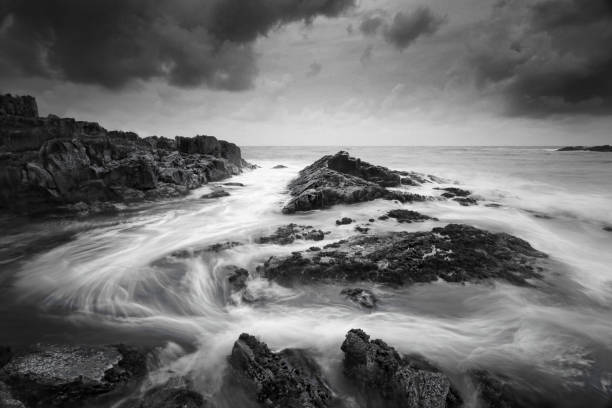 istock Seascape at low tide with moody clouds and swirling flows 917525456