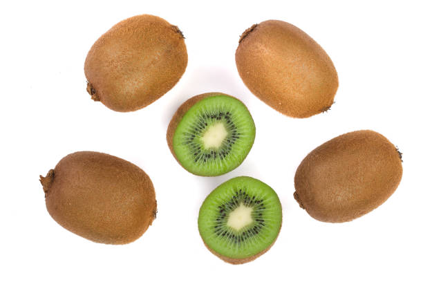 istock Kiwi fruit with slices isolated on white background, close-up. Top view. Flat lay pattern 917528566
