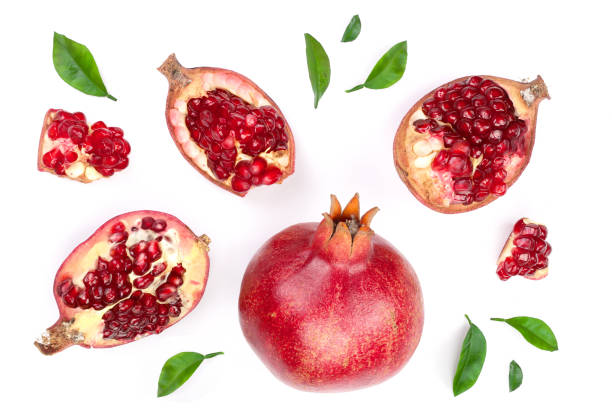 istock pomegranate with leaves isolated on white background. Top view. Flat lay pattern 917529066