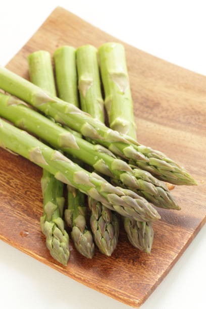 istock freshness green asparagus on wooden plat 917531728