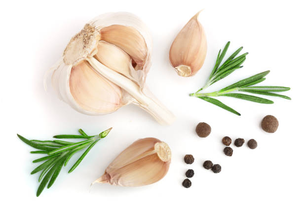 istock garlic with rosemary and peppercorn isolated on white background. Top view. Flat lay pattern 917532112