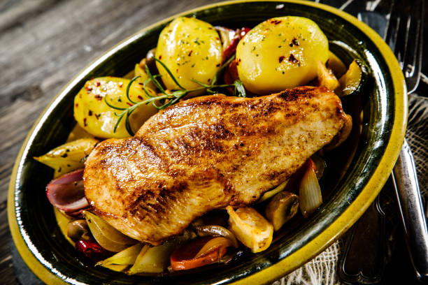 istock Grilled chicken breast, boiled potatoes and vegetables 917532278