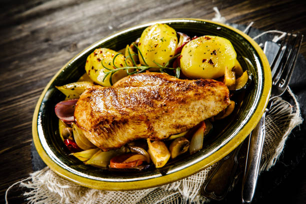 istock Grilled chicken breast, boiled potatoes and vegetables 917532318