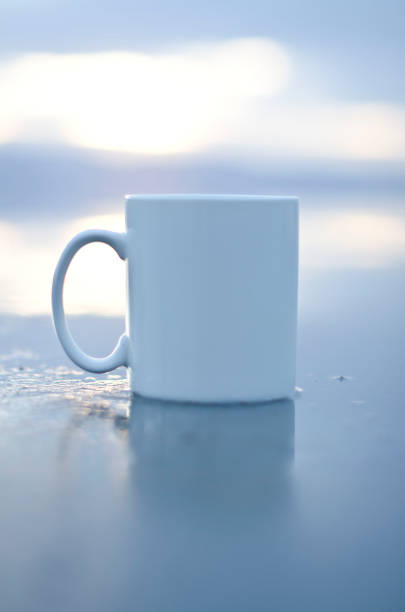istock Blank White Coffee Mug on the water 917532428