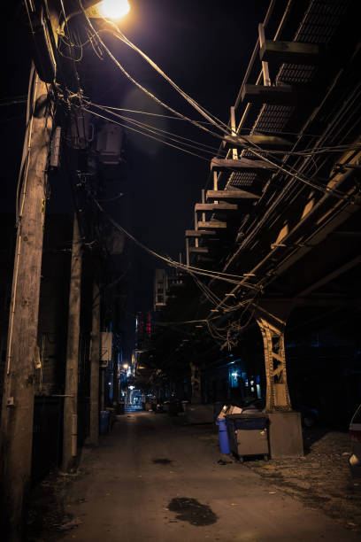 istock Dark city alley at night. 917532790