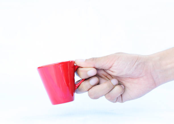 istock Hand holding Red Cups Isolated on white backgrounds 917535284