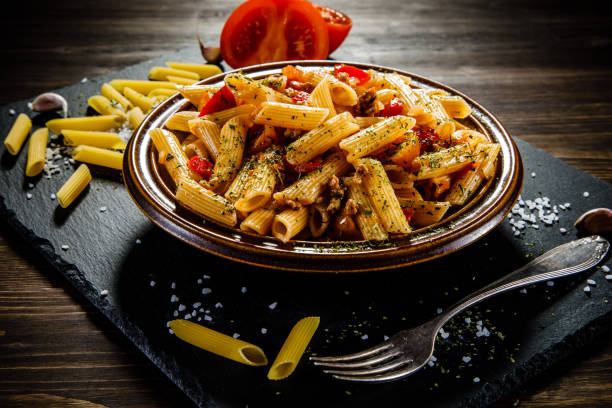istock Penne with sauce and pork 917535432