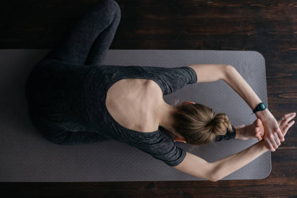 istock Young woman practicing yoga in the loft 917539078