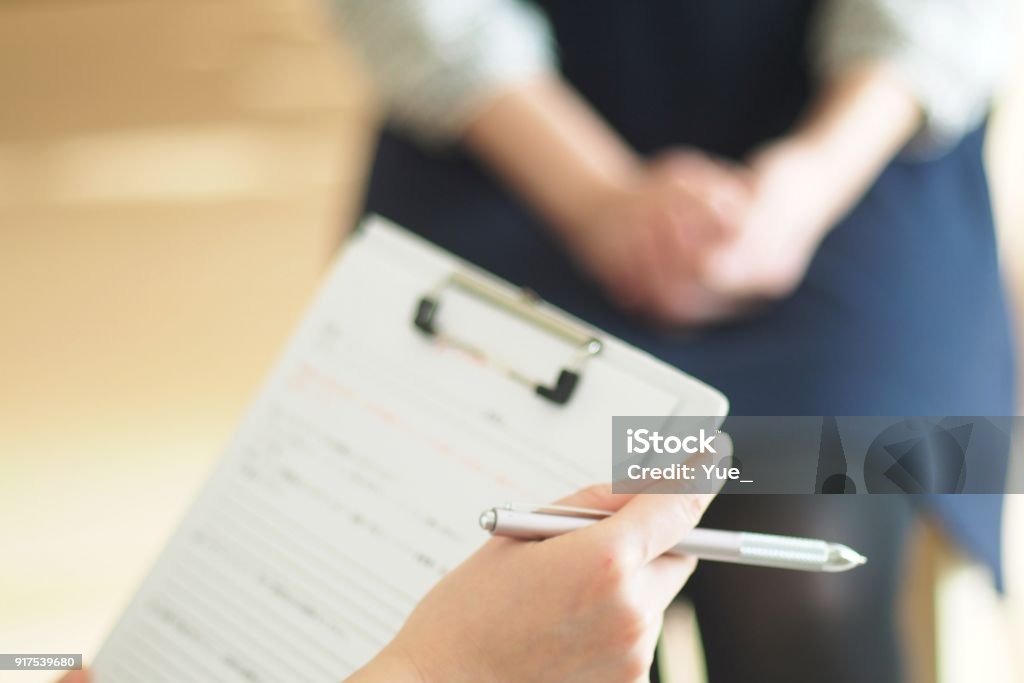 Young woman's aromatherapist counseling patient Young woman's aromatherapist counseling patient in Japan Medical Exam Stock Photo