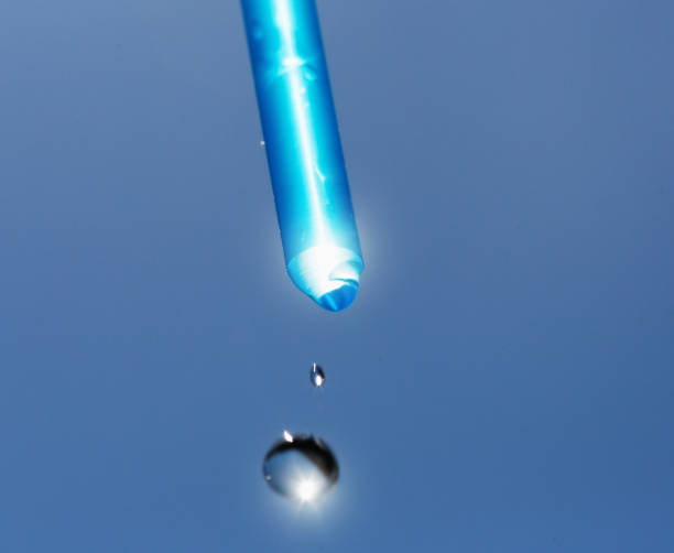 istock Water droplets falling from tube 917546472