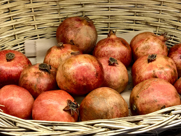 istock Pomegranates in a wicker basket 917550710