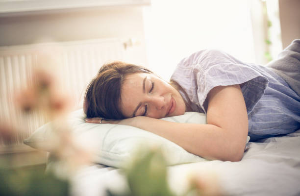 sleepy woman. - sleeping women pillow bed imagens e fotografias de stock