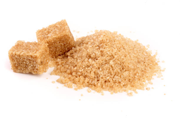 istock brown sugar heap isolated on white background 917554562