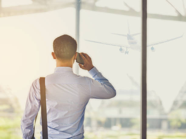 istock An Asian businessman is using a smartphone to get in business while waiting for a trip in the airport. 917558564
