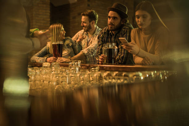 istock Group of young people spending their night out in a bar. 917558756