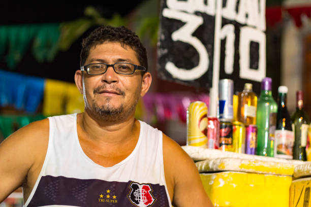 Recife: A street drinks vendor at the night of Carnival. The beginning of the celebration of Carnival in Recife just one day before the official day on Friday 9th.