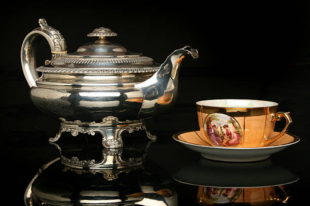 istock Silver teapot and an antique chinese cup 91755964