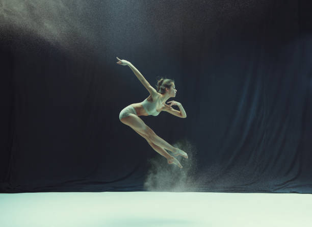istock Young teen dancer ion white floor background 917566686