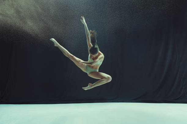 istock Young teen dancer ion white floor background 917568774