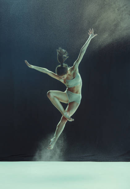 istock Young teen dancer ion white floor background 917568884