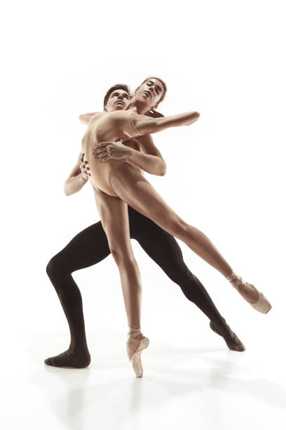 istock The two young modern ballet dancers posing over gray studio background 917569524