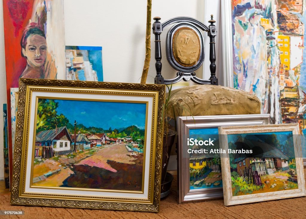 Valuable paintings collection Collection of different types of handmade framed paintings in the workshop. Art Stock Photo