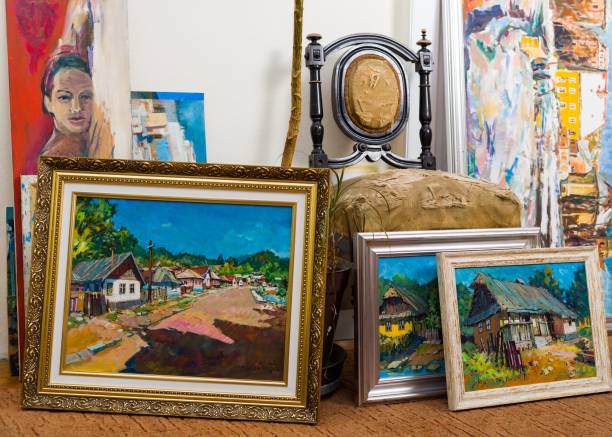 Valuable paintings collection Collection of different types of handmade framed paintings in the workshop. collection stock pictures, royalty-free photos & images
