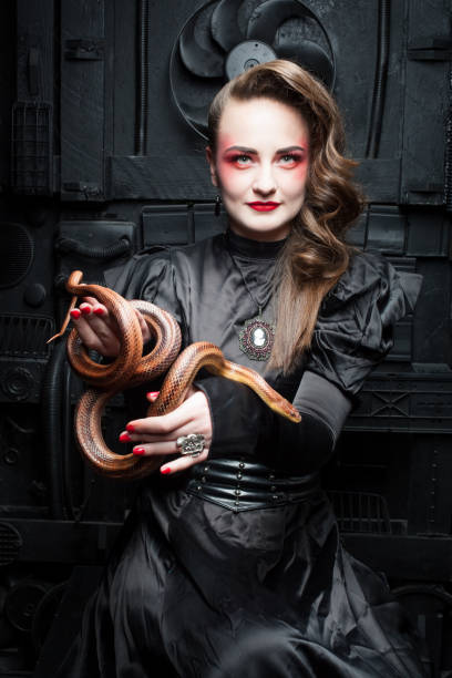 istock Woman with a snake. 917574412