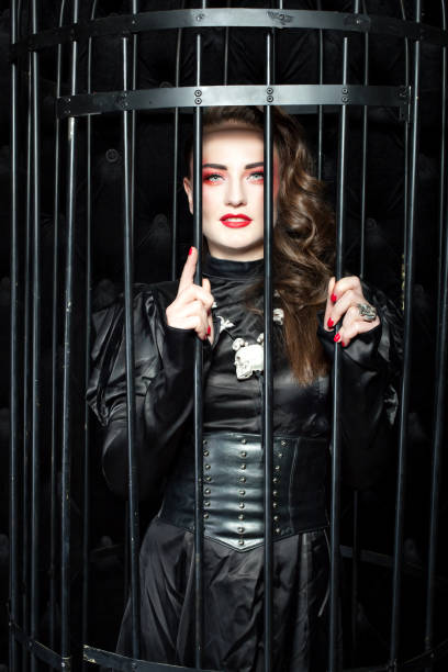 istock Woman with bright makeup in the cage. 917574662