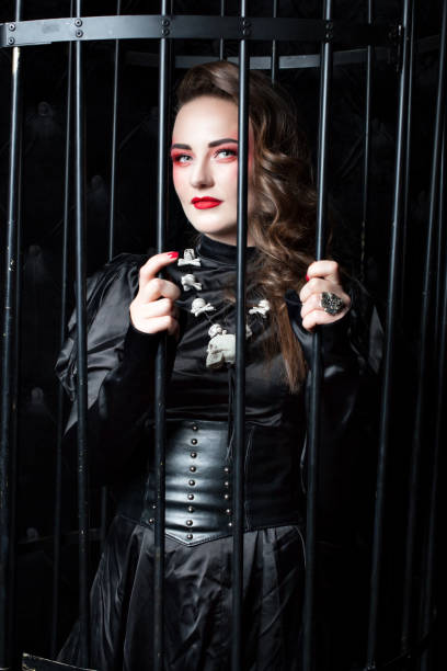 istock Young woman with bright makeup in the cage. 917574696
