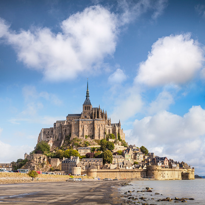 Mont St Michel, Normandy, France, on a bright summer day. It is France's most visited provincial tourist attraction, and is often claimed by Brittany as it's very close to the border.