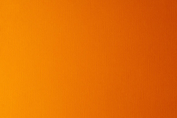 istock Orange paper textured background, close up. 917574960