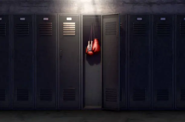 A row of metal gym lockers with one open door revealing that it has a pair of boxing gloves hanging up inside - 3D render