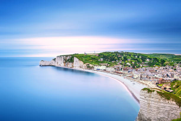 Etretat village. Aerial view from the cliff. Normandy, France. Etretat village and its bay beach, aerial view from cliff. Normandy, France, Europe. Long exposure photography normandy photos stock pictures, royalty-free photos & images