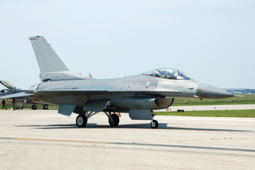 Beja, Portugal: parked General Dynamics F-16CJ Fighting Falcon of the United States Air Force 480th Fighter Squadron 'Warhawks', 52nd Fighter Wing, based in Spangdahlem Air Base, Germany configured for Suppression of Enemy Air Defenses - weapons on the wing: AIM-120 AMRAAM, middle AIM-9 Sidewinder, right AGM-88 HARM - Beja Airport serves both civil and military aviation.