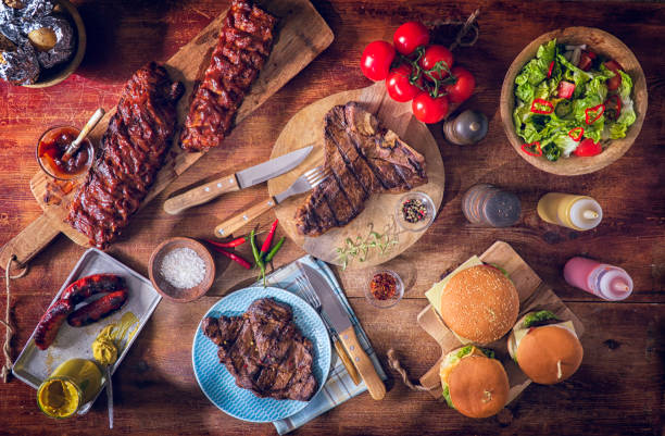 variation of roasted bbq rib eye,  t-bone steak, spareribs and burgers - beef meat t bone steak steak imagens e fotografias de stock