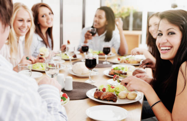 istock Dinner or lunch party with young friends enjoying themselves 917587424